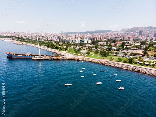 Aerial Drone View of Kartal Istanbul City Seaside with Garbage Scow Vessel Old Ship.