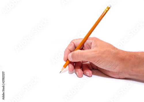 Pencil in the hand of a student on a white background, side view