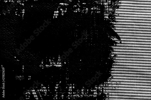 Grunge Black and white closeup of stripped fabric texture.