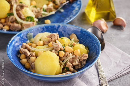 Stewed lamb with potatoes and chikpeas. photo