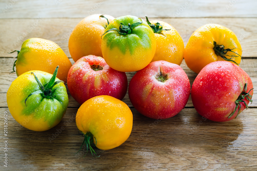 Yellow And Red Tomatoes On A Wooden Table