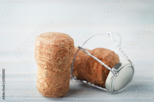 Champagne corks with caps on blue wooden table