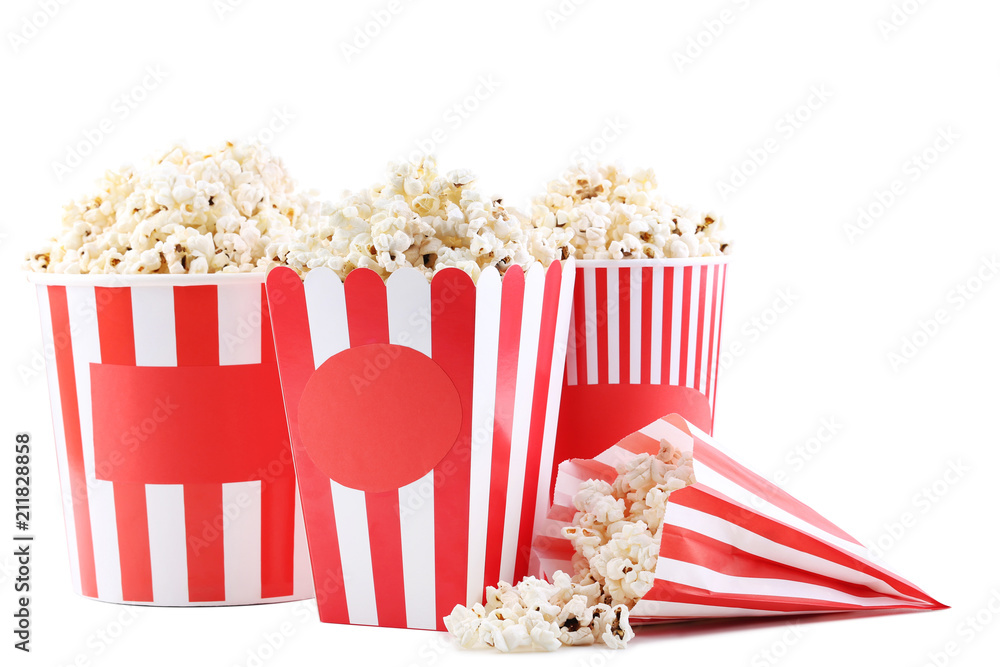 Popcorn in striped buckets and paper bag isolated on white background