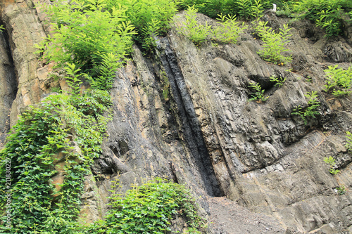 visible layer of coal in the rock on Landek hill near Ostrava, Czech Republic