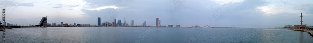Bahrain skyline during evening hours at sunset, a panoramic view