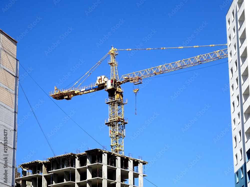 Tower crane and a dwelling house