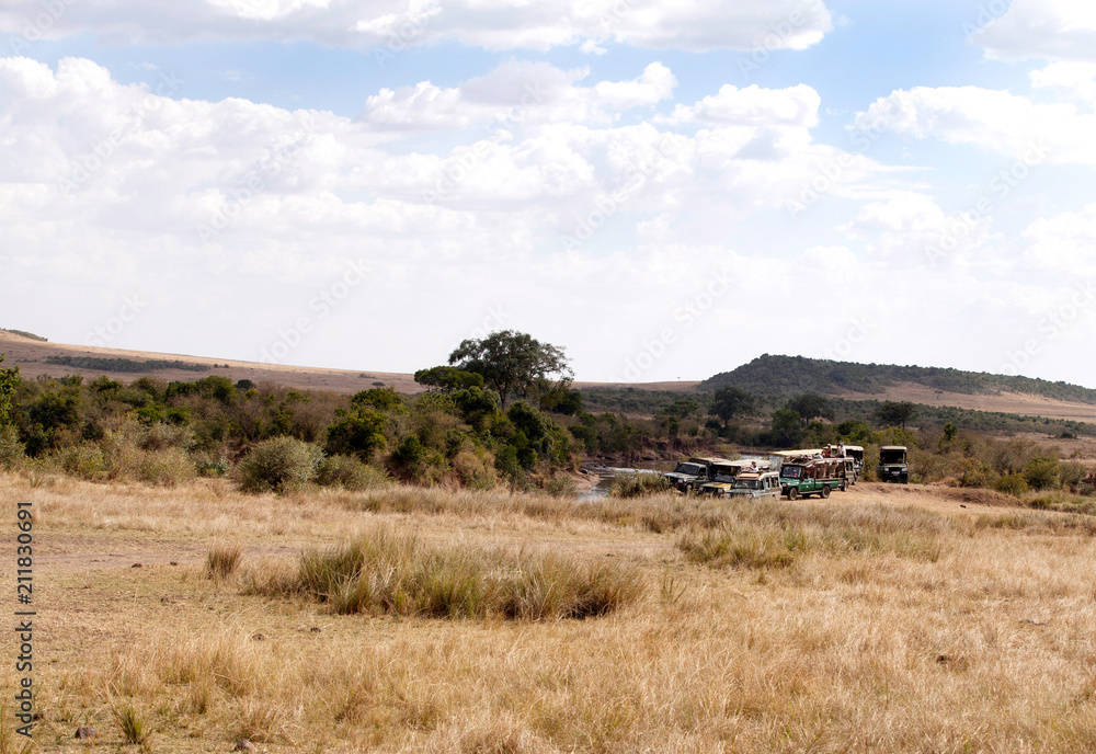 Fototapeta premium Tourists enjyoing game drive in Masai Mara National Reserve