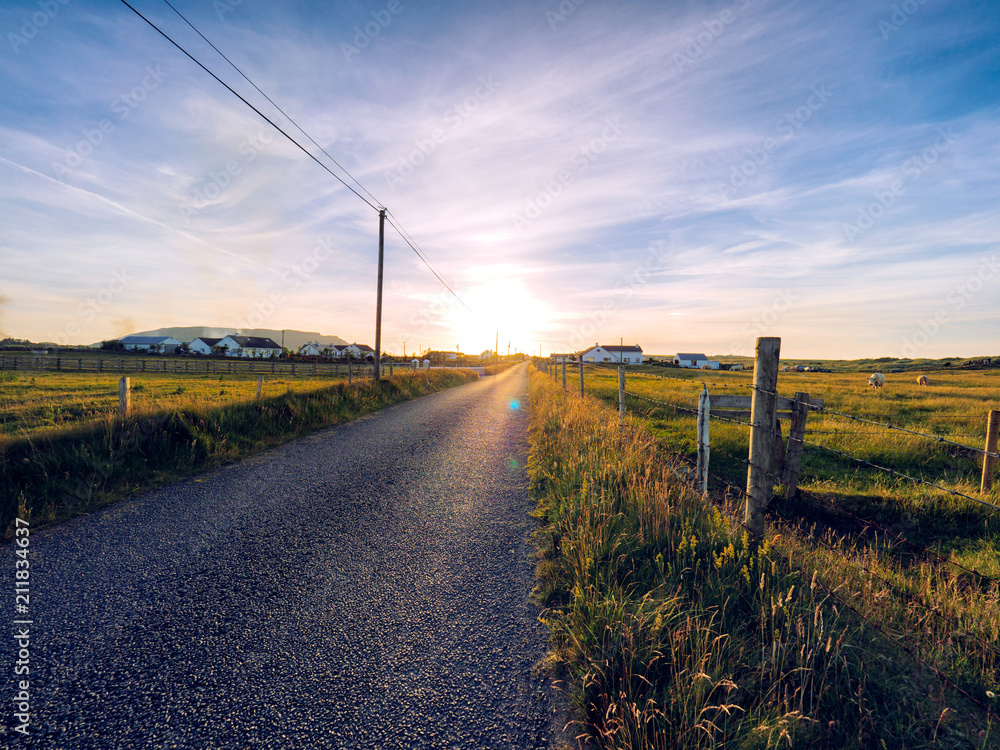 Sunset summer countryside road,Ireland Sunset summer countryside road,Ireland