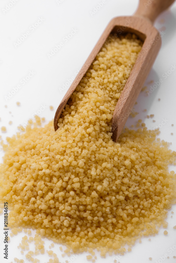 fresh couscous on a white acrylic background fresh couscous on a white acrylic background