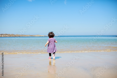 baby girl playing at summer beach © M-image