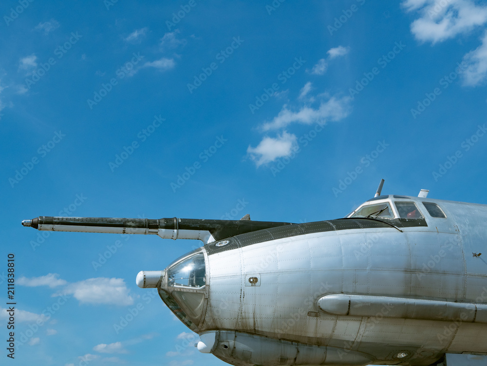 close-up side view of airplane cockpit with blue sky on background close-up side view of airplane cockpit with blue sky on background