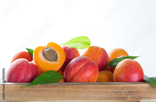 Fresh apricots on a white w...