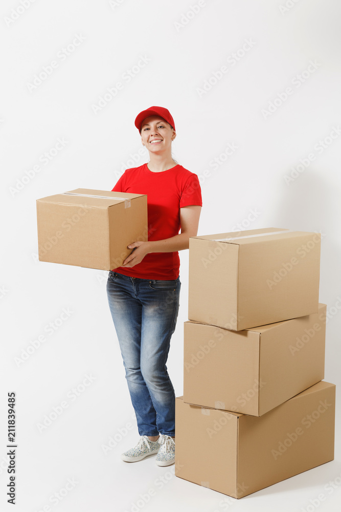 Full length portrait of delivery woman in red cap, t-shirt giving order boxes isolated on white background. Female courier near empty cardboard boxes. Receiving package. Copy space for advertisement. Full length portrait of delivery woman in red cap, t-shirt giving order boxes isolated on white background. Female courier near empty cardboard boxes. Receiving package. Copy space for advertisement.