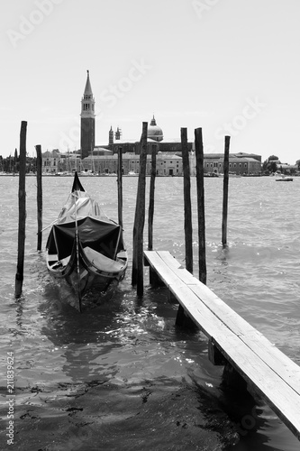 Moored gondola and San Giorgio di Maggiore church in Venice photo