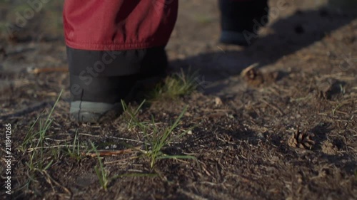Wallpaper Mural slow motion close-up of shoes a man walks through the forest Torontodigital.ca