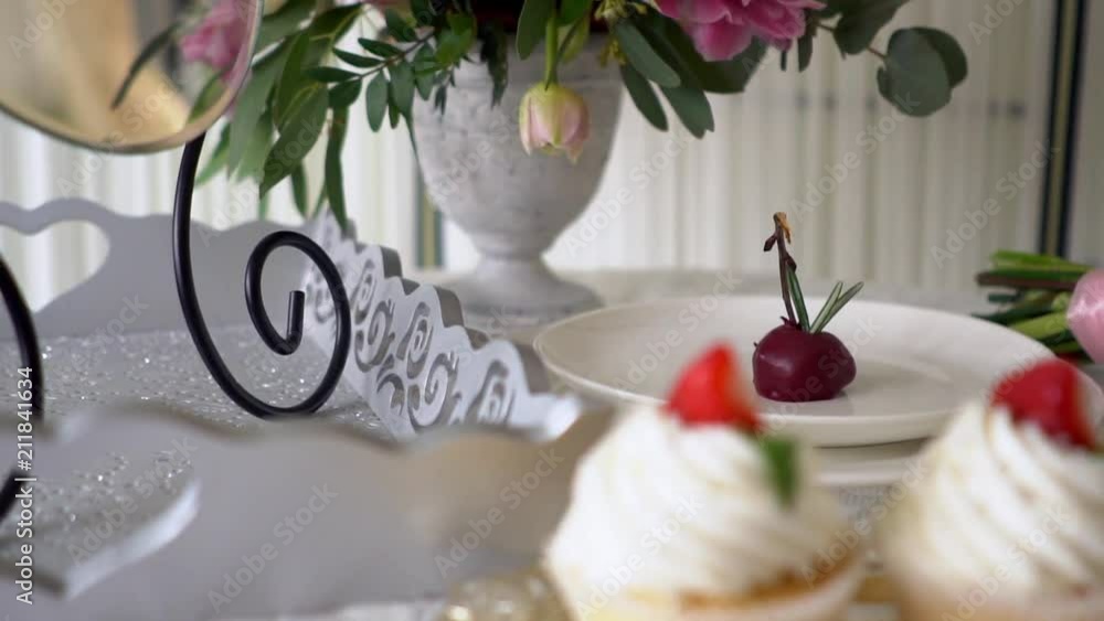 Cupcake are surrounded by beautiful roses. Cupcake are surrounded by beautiful roses.