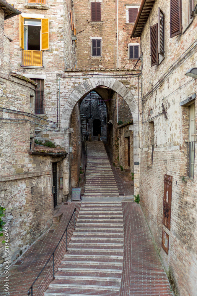 Street with arch doorway in Italy