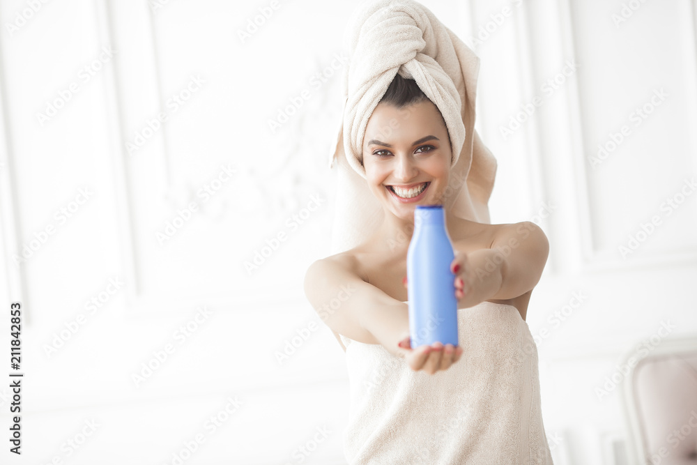 Beautiful woman in the towel after bathing