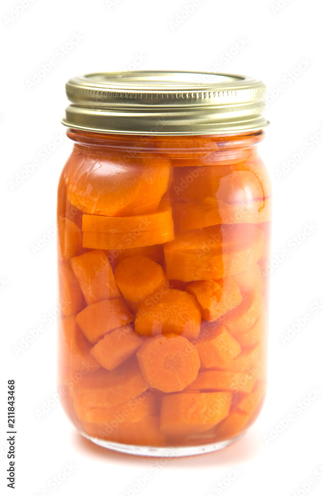 Carrots on a White Background in a Home Canning Jar Carrots on a White Background in a Home Canning Jar