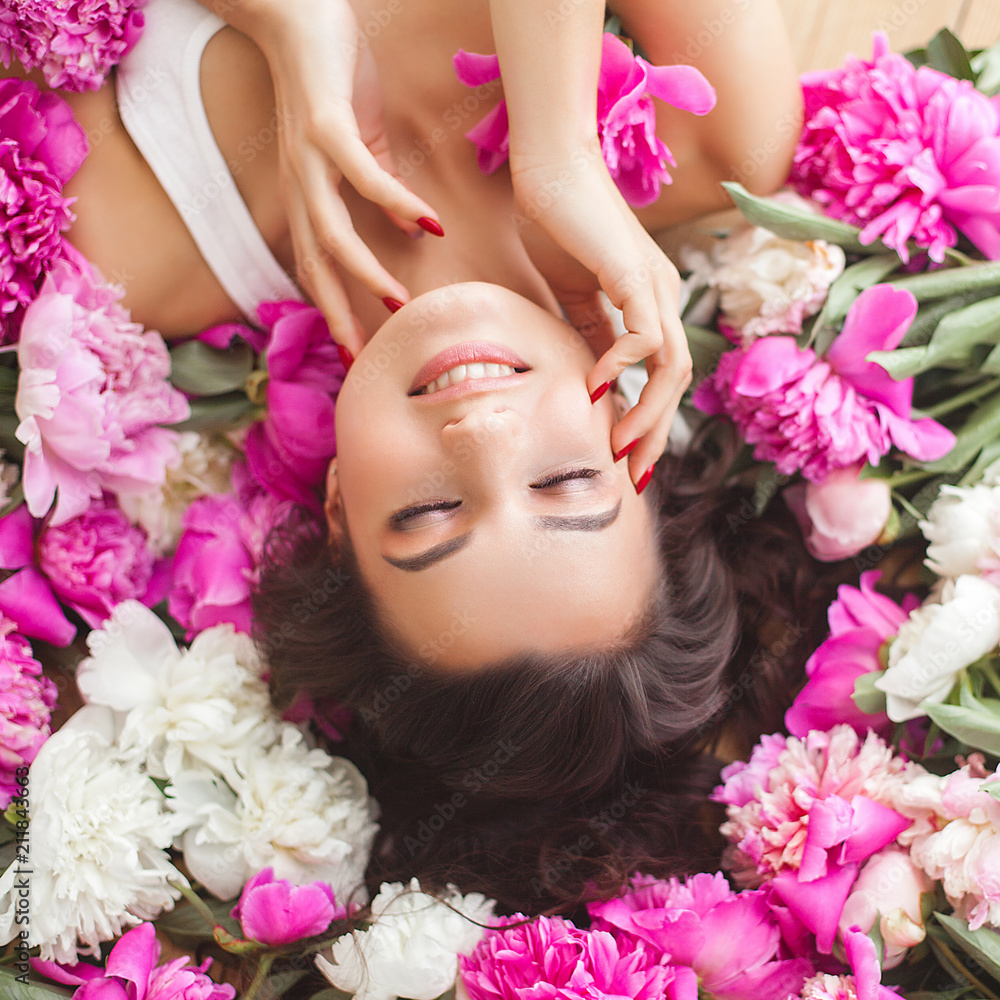Young attractive woman with flowers Young attractive woman with flowers
