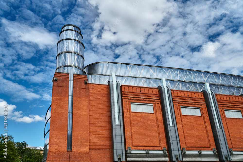 The metal structure  and brick wall in an old brewery in Poznan.