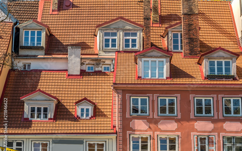 View of old houses walls with windows and roofs in historic center of Riga, Latvia.