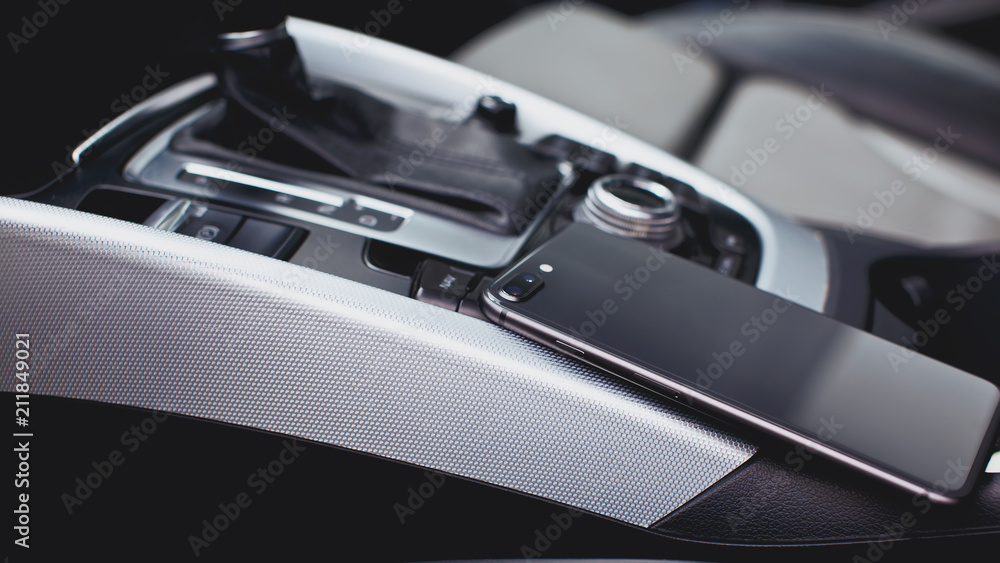 smartphone with dual camera in the interior of a modern car smartphone with dual camera in the interior of a modern car