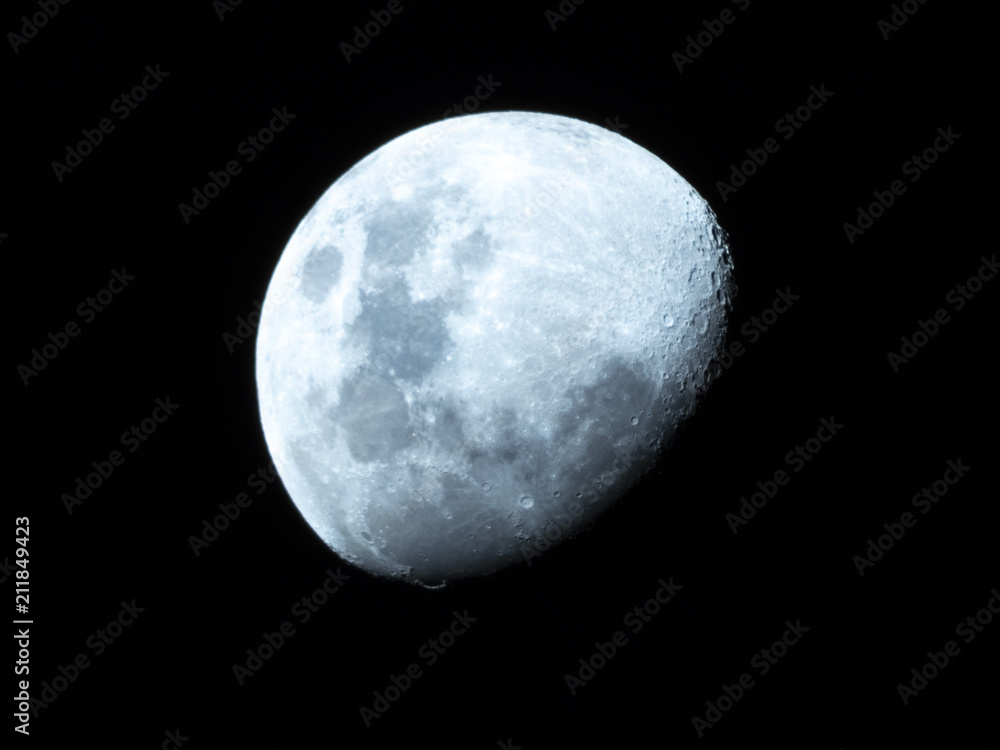 Half Moon, Crescent moon, gibbous moon in the middle of its way on the clear sky. Half Moon, Crescent moon, gibbous moon in the middle of its way on the clear sky.