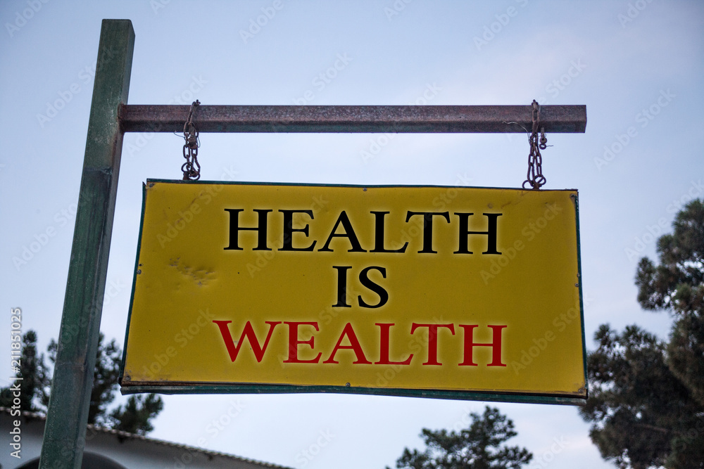 Handwriting text Health Is Wealth. Concept meaning being in good shape great value Stay healthy eat Healthy Messages object location yellow banner frame metal board billboard yellow.