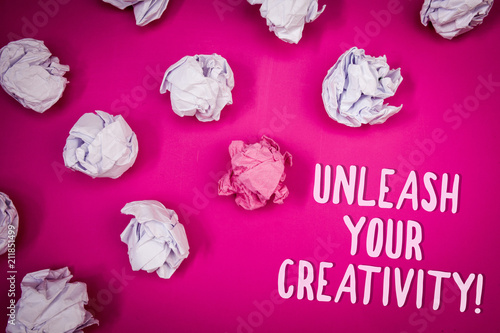 Conceptual hand writing showing Unleash Your Creativity Call. Business photo text Develop Personal Intelligence Wittiness Wisdom Ideas pink background crumpled papers trial mistakes several tries. photo