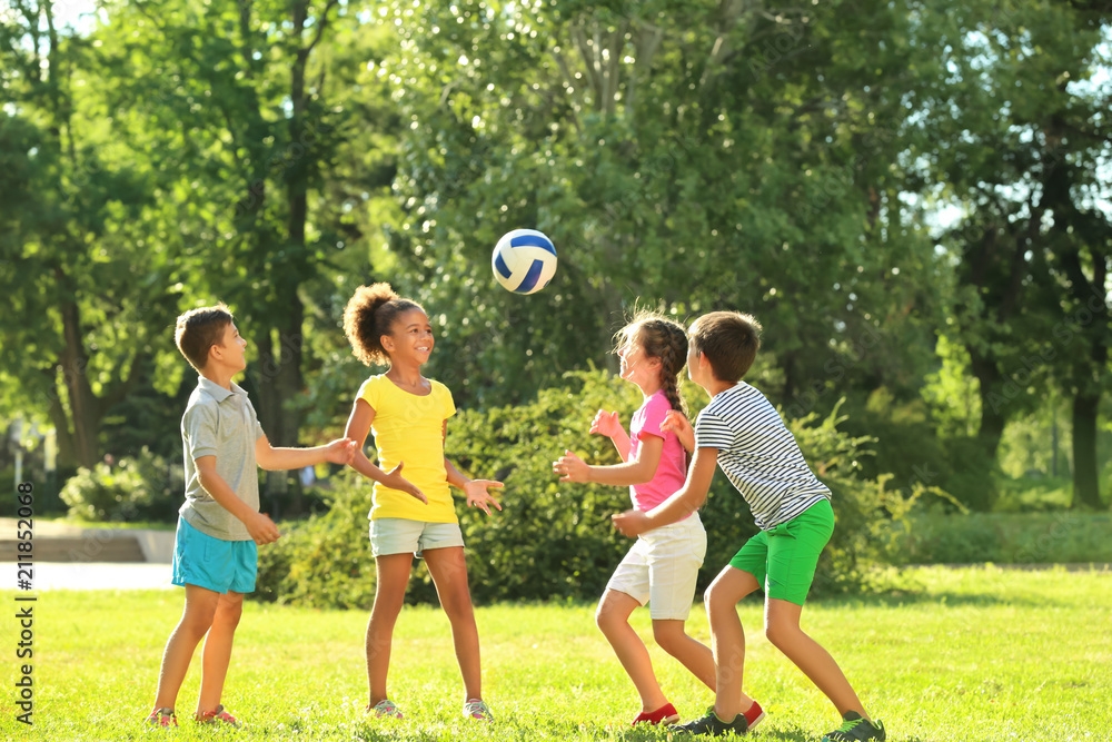 Obraz premium Cute children playing with ball in park