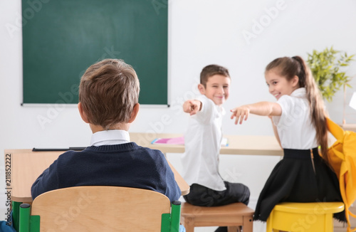 Children bullying their cla...