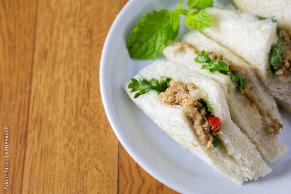 bread sandwich with tuna fish, slices on plate bread sandwich with tuna fish, slices on plate