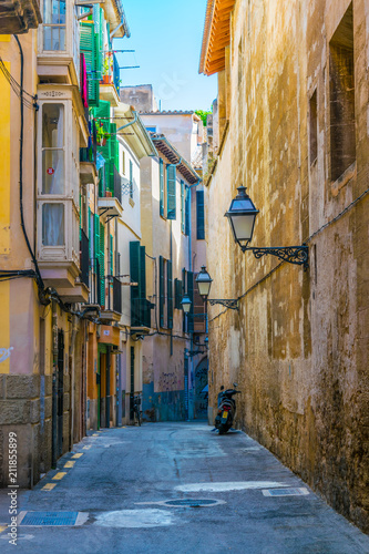 View of a narrow street in the historical center of Palma de Mallorca, Spain photo