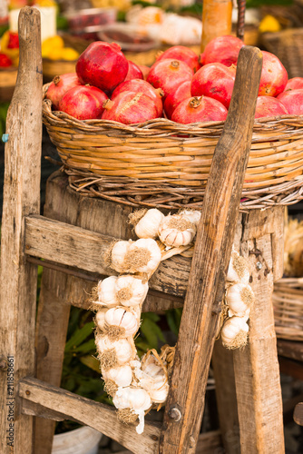 Pomegranates and garlic on display at Campo de Fiori Market, Rome, Lazio photo