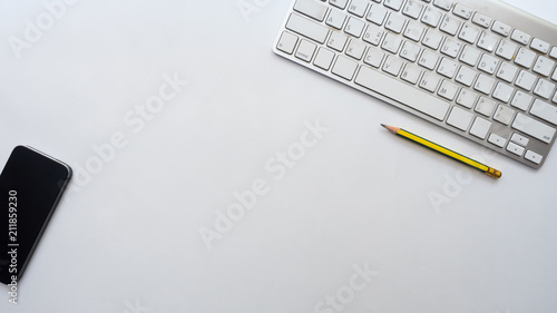 smart phone and keyboard on white background business concept