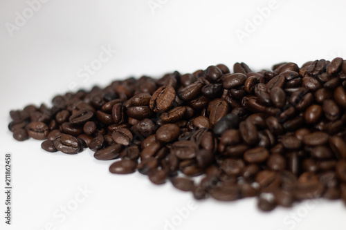 beverage concept of coffee beans heap . black and brown color seeds isolated on white background with copy space