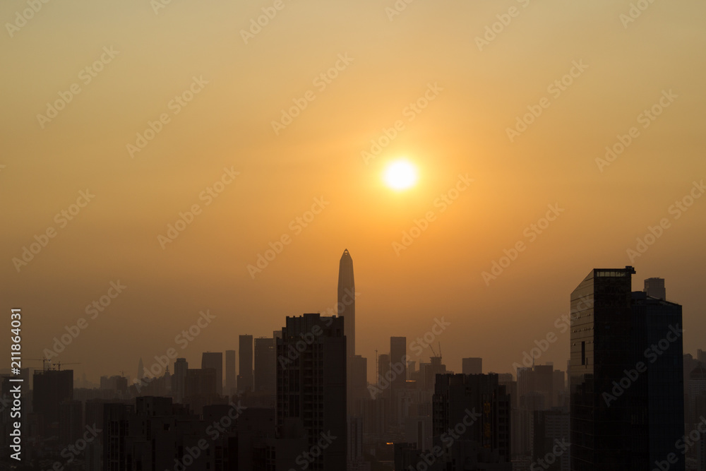 The setting sun and the architectural silhouette