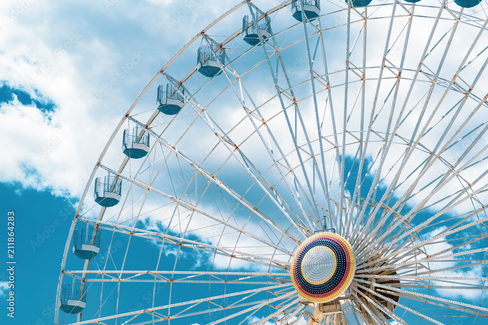 Fototapeta premium Ferris Wheel at Ocean CIty New Jersey Boardwalk with Blue Sky and Epic Clouds