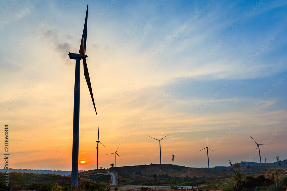 Obraz premium Silhouette of wind turbines farm