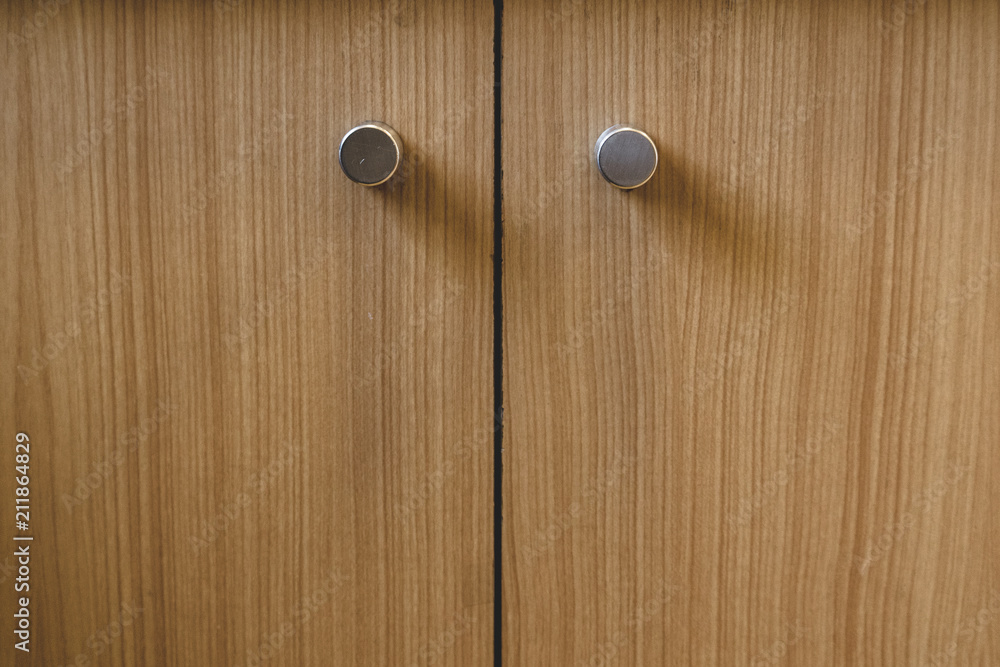 Cupboard doors with round handles with wood veneer finish Cupboard doors with round handles with wood veneer finish