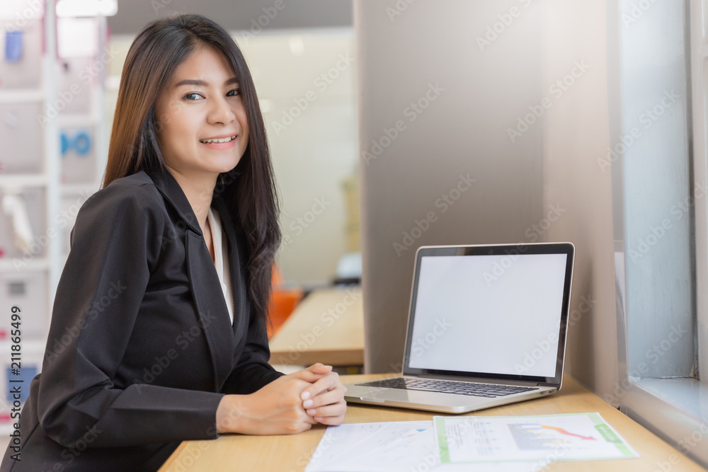 Business woman working in modern office with computer laptop and document for background. Business woman working in modern office with computer laptop and document for background.