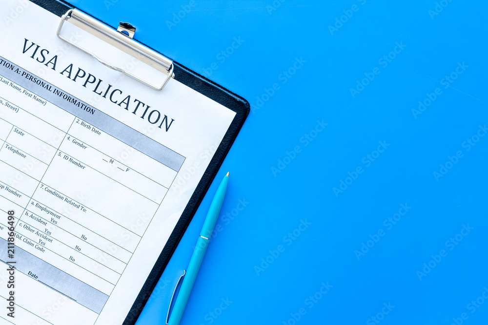 Visa prosessing. Registration of visas. Visa application form and pen on  blue background top view copy space Stock Photo | Adobe Stock