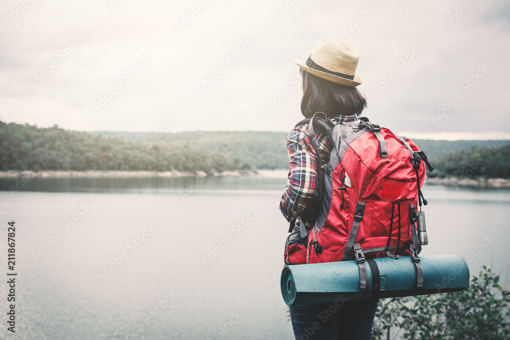 Obraz premium Happy Asian woman relaxing on holiday travel concept,selective and soft focus,tone of hipster style