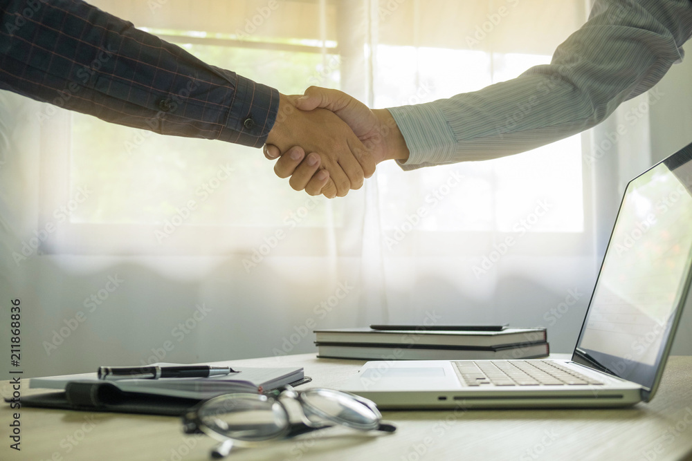 Business handshake. Business people shaking hands, finishing up a meeting,Success agreement negotiation. Business handshake. Business people shaking hands, finishing up a meeting,Success agreement negotiation.