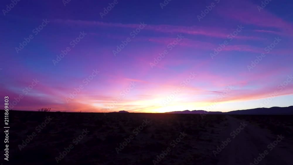 Ethereal sunrise over the desert with waves of color, Time Lapse Ethereal sunrise over the desert with waves of color, Time Lapse
