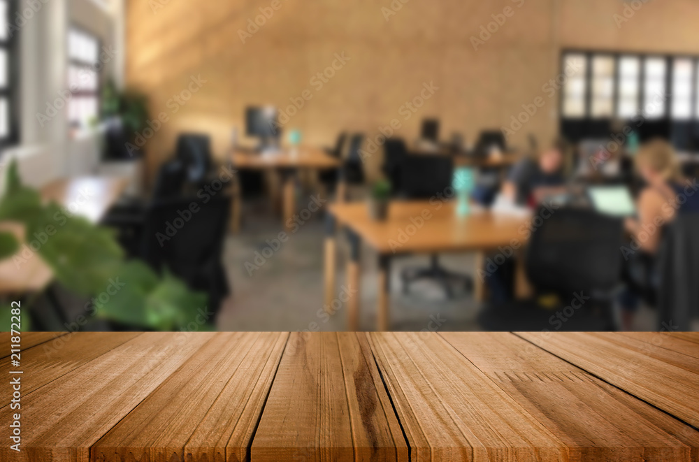 Selected focus empty brown wooden table in office with big windows of the Background with bokeh image. for your photomontage or product display Selected focus empty brown wooden table in office with big windows of the Background with bokeh image. for your photomontage or product display