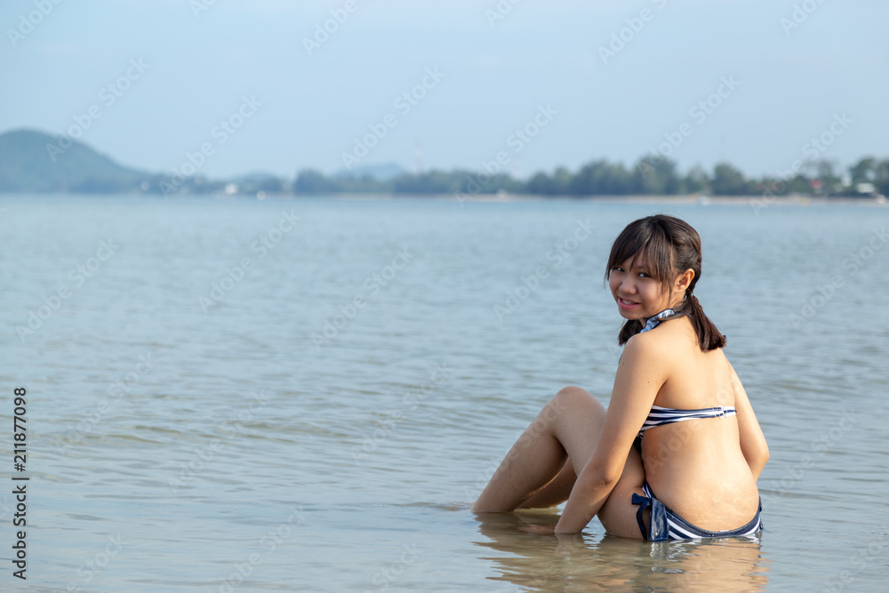 Teenage wearing bikini at the beach. Teenage wearing bikini at the beach.