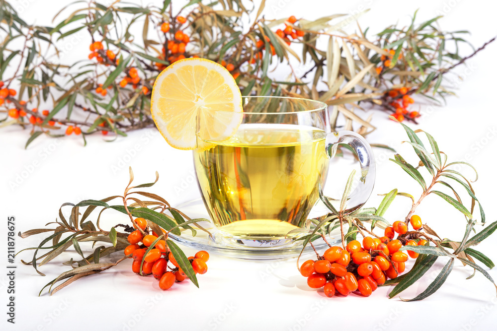 Herbal tea with lemon and sea-buckthorn. Healthy tea. Isolated on a white background Herbal tea with lemon and sea-buckthorn. Healthy tea. Isolated on a white background
