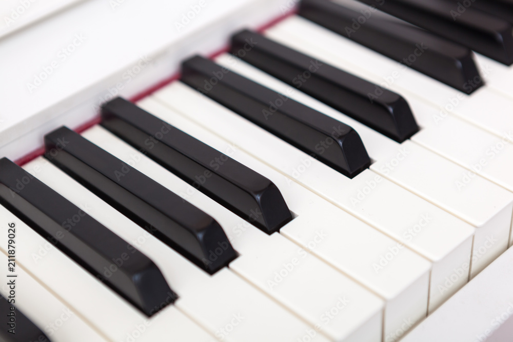 Close up of black and white piano keys. Close up of black and white piano keys.